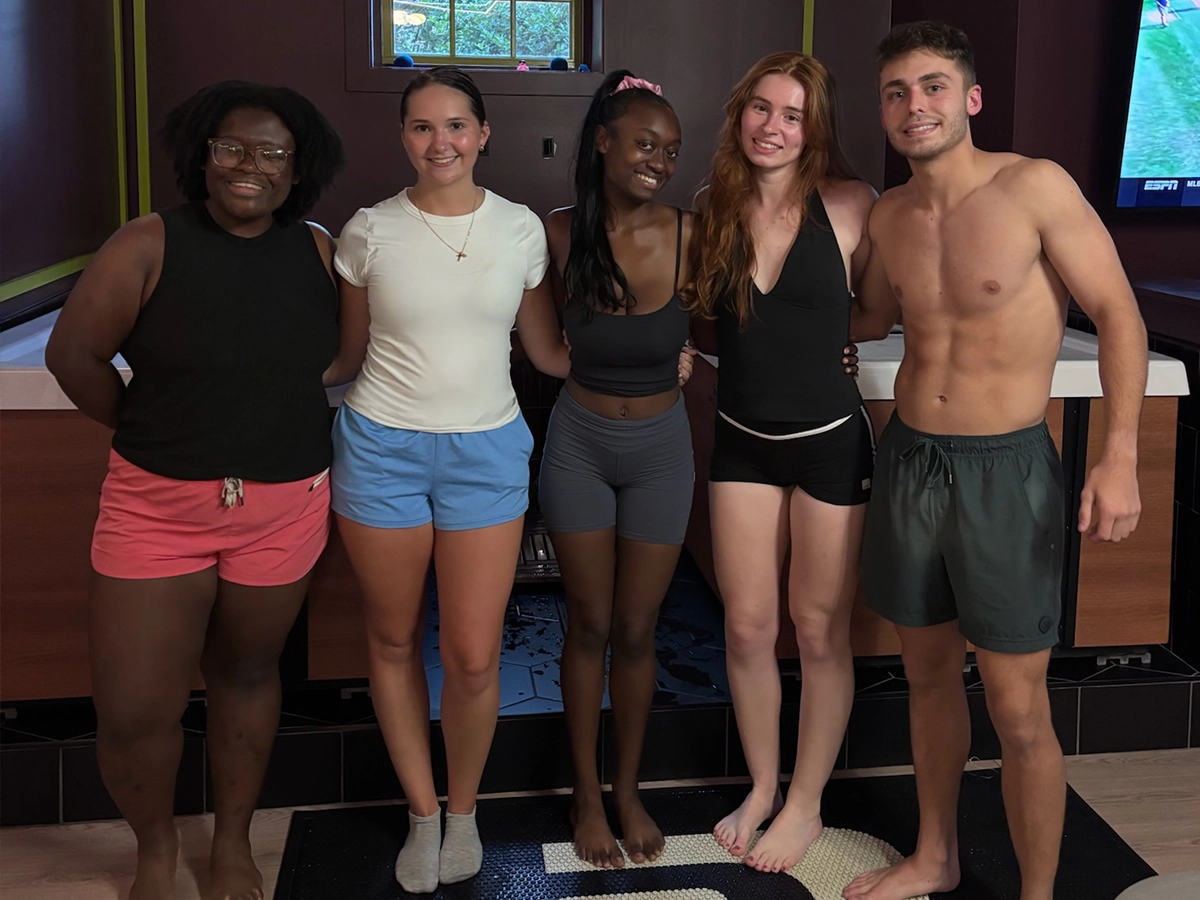 Group of five friends together in the plunge room at R3 Contrast